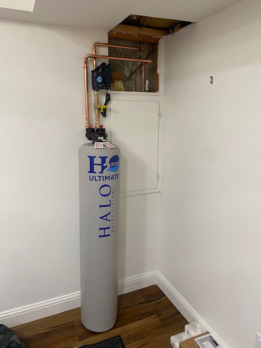 Installed water filtration tank with piping connections